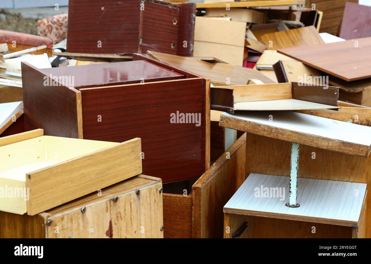 Old broken wooden furniture on waste dump site Stock Photo Alamy
