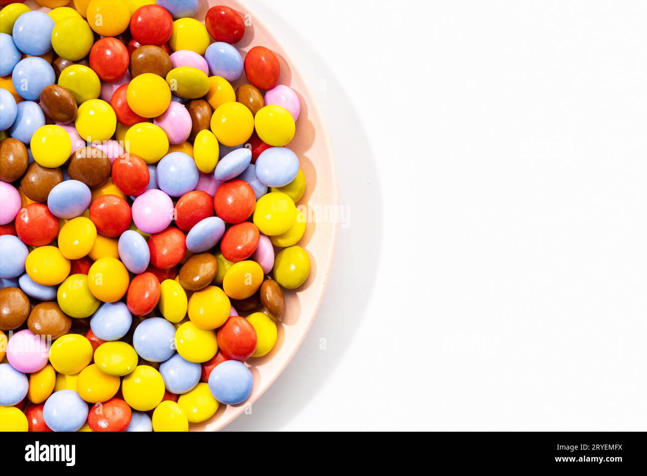Multicolored Chocolate candy in plate Stock Photo