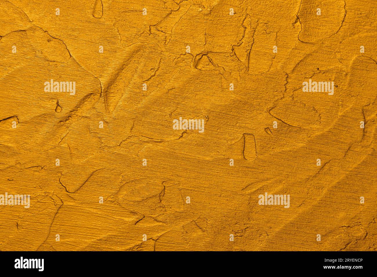 Golden uneven grunge surface abstract background Stock Photo