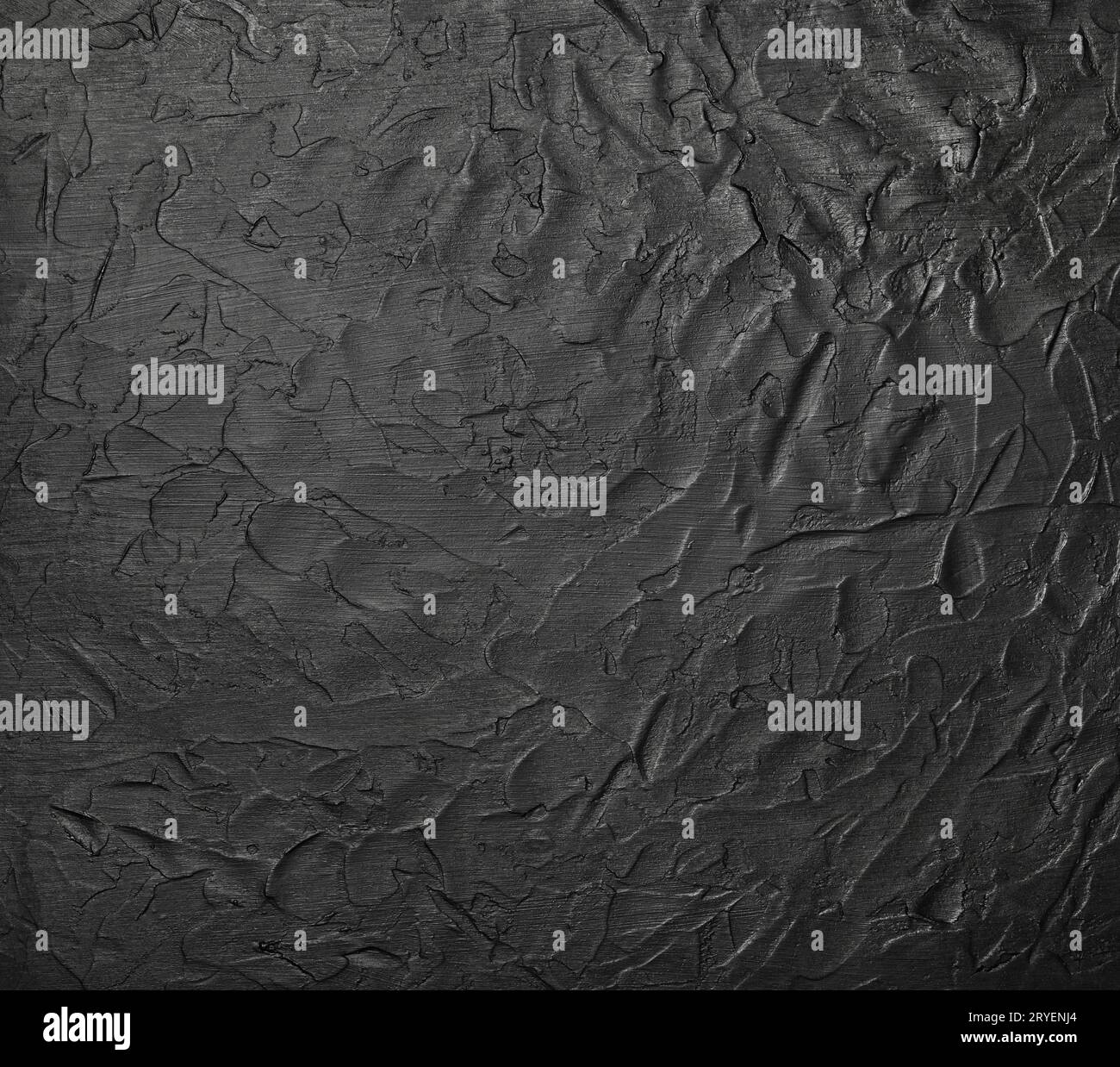 Black uneven grunge surface abstract background Stock Photo
