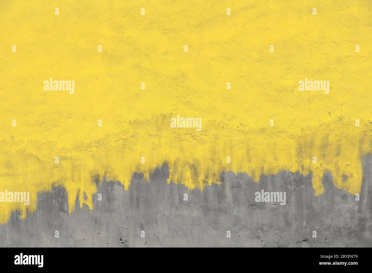 Weathered yellow painted gray concrete wall Stock Photo
