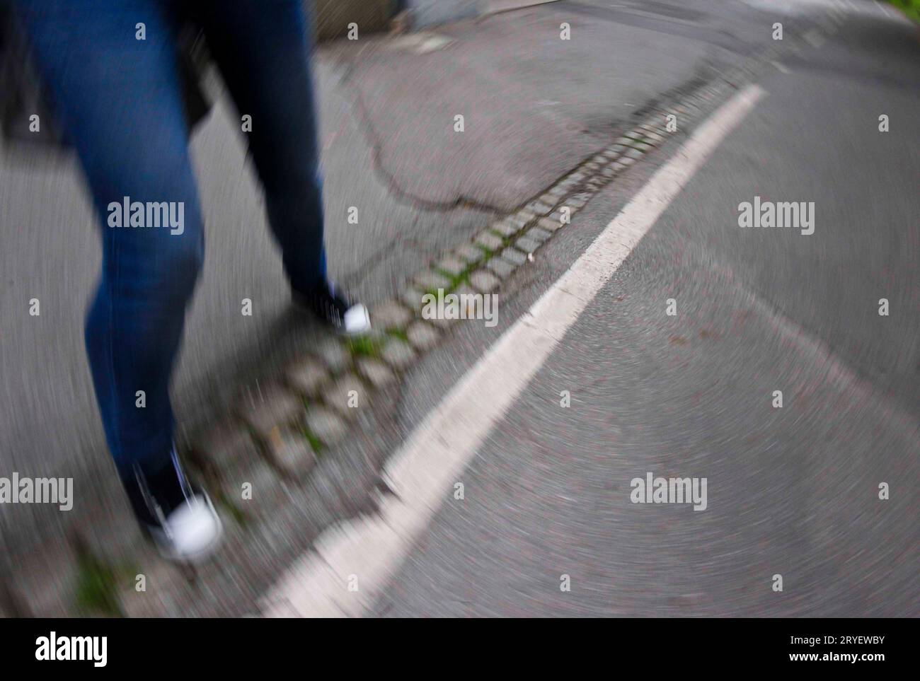 Pedestrian walking on the street Stock Photo