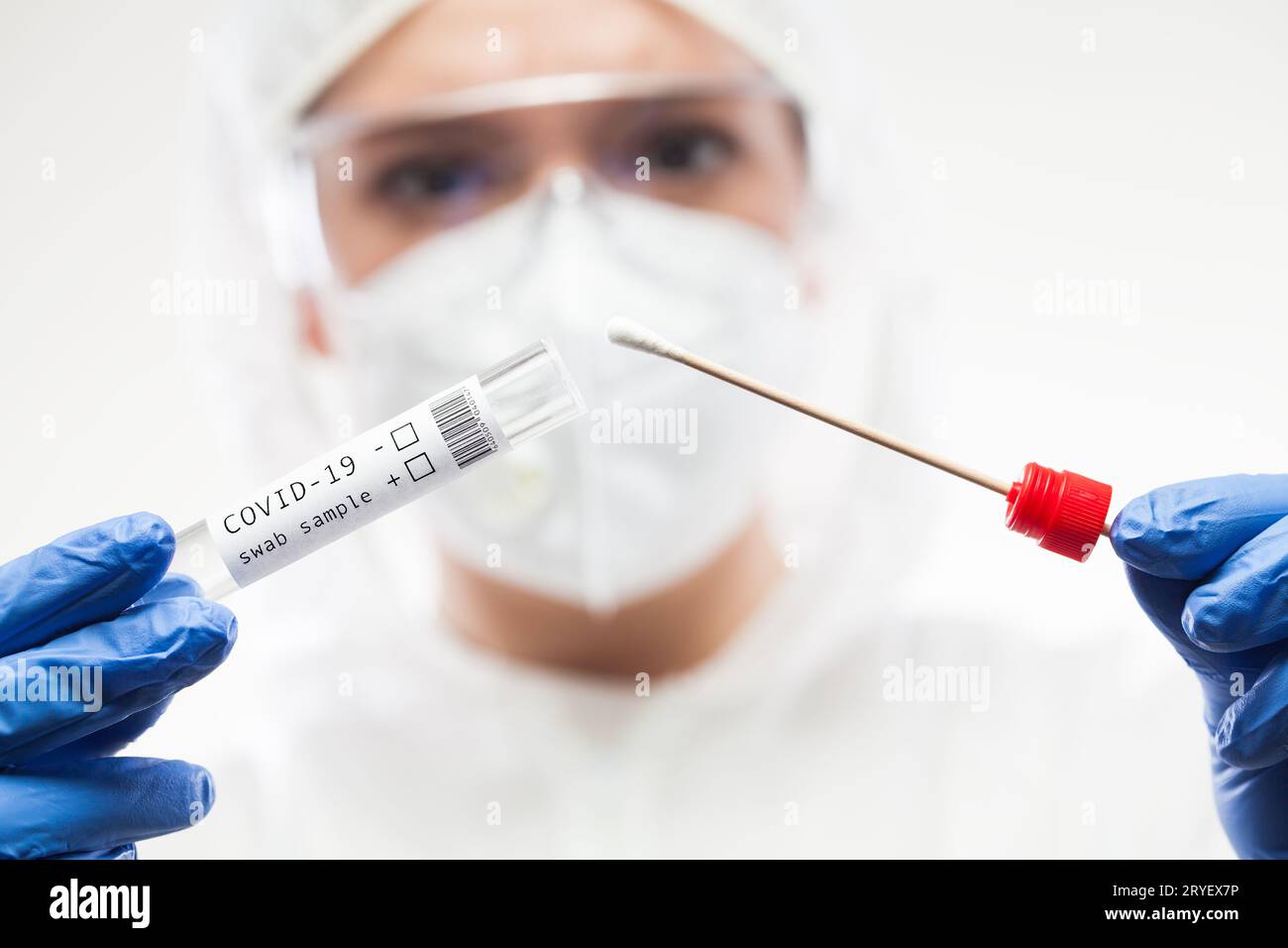 Medical UK healthcare technologist holding COVID-19 swab collection kit Stock Photo