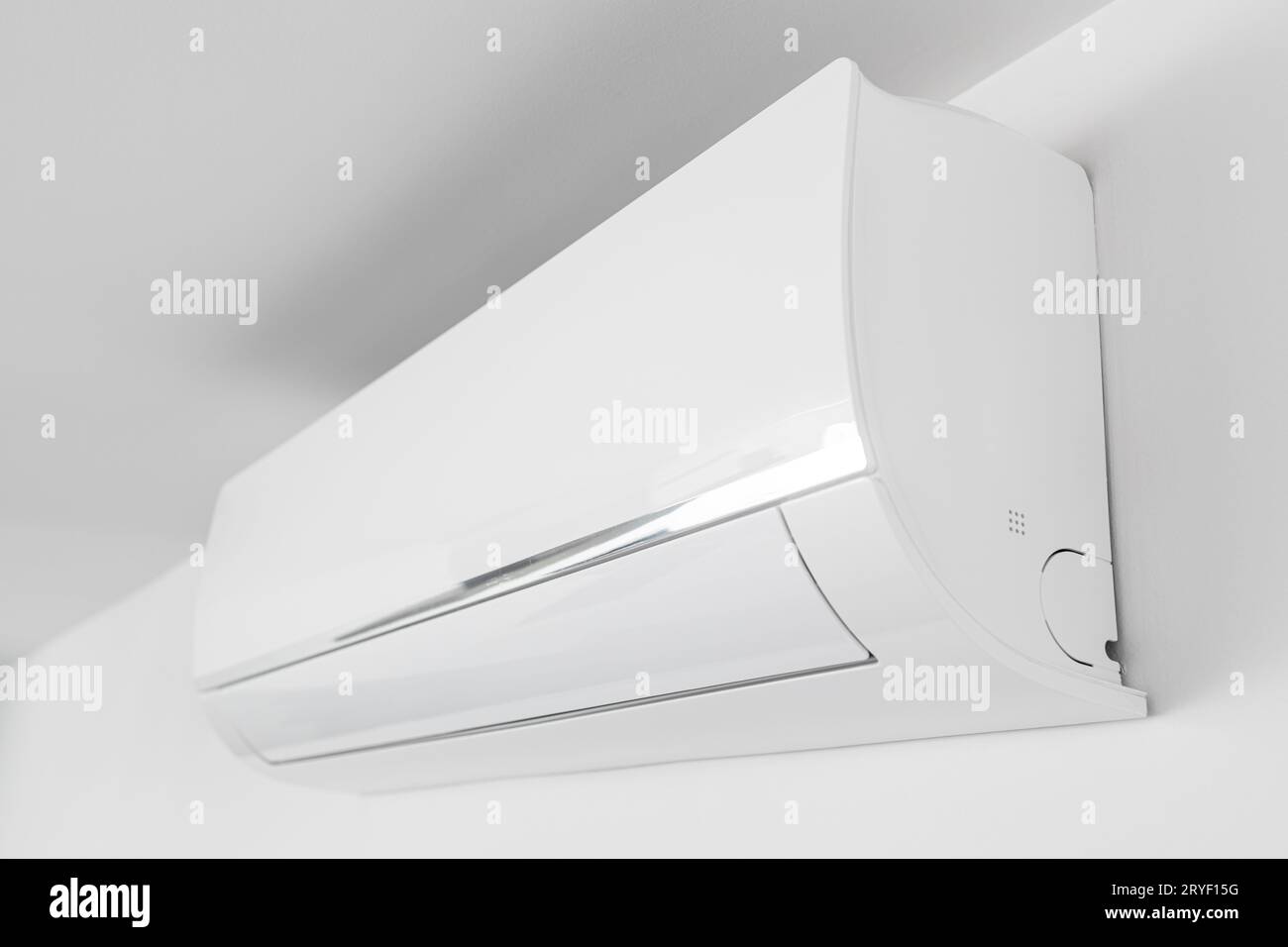 Indoor Air conditioner unit mounted on wall used for cooling space Stock Photo