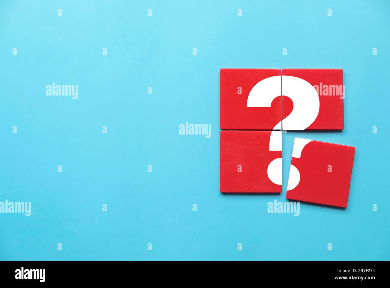 Q&A or questions and answers concept. Red square puzzle with a symbol of question mark. Copy space. Stock Photo