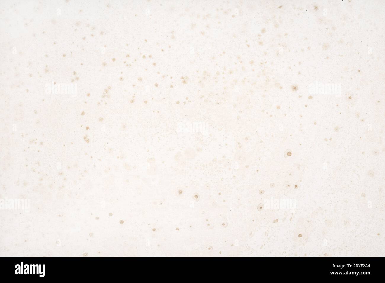 Old and dirty paper background with stains and humidity effects Stock Photo