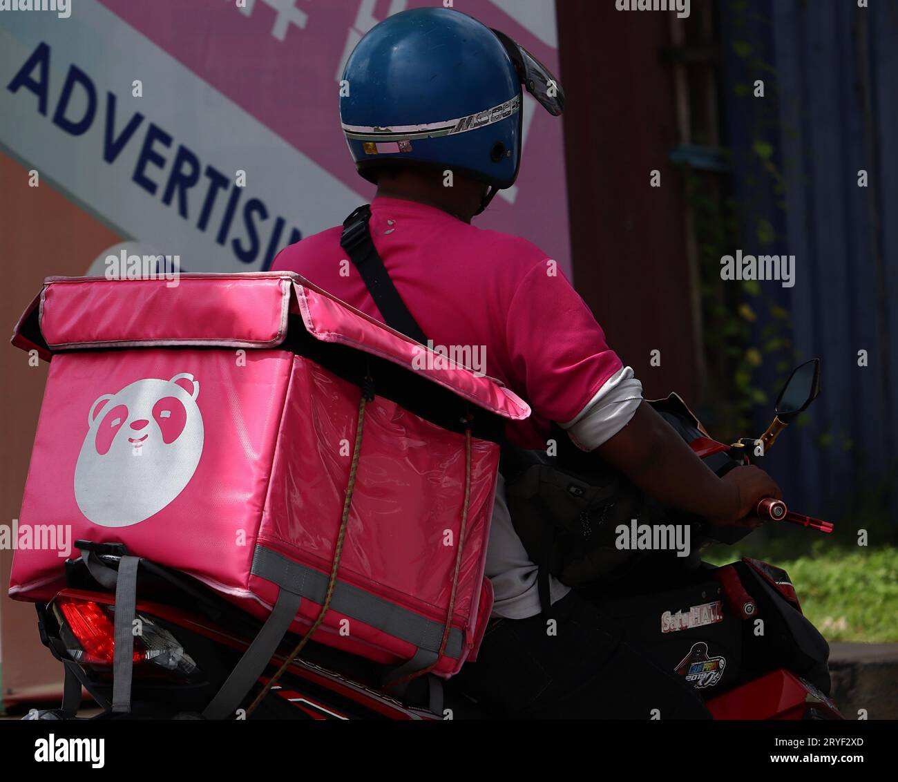 Foodpanda logo printed on the container bag that is placed on the back