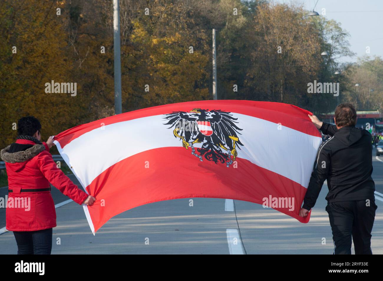 People with austria flag on street Stock Photo