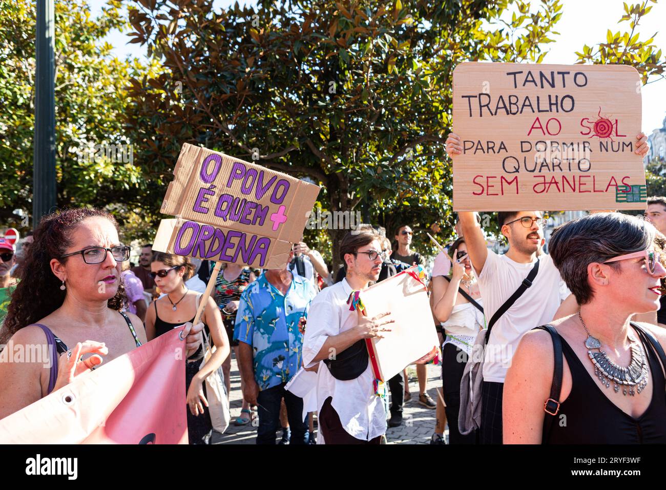 Porto, Portugal. 30th Sep, 2023. Protesters hold placards expressing their  opinion during the demonstration. "Houses to live" Protest took place in  Porto, started in Batalha Square and ended in Aliados, in front