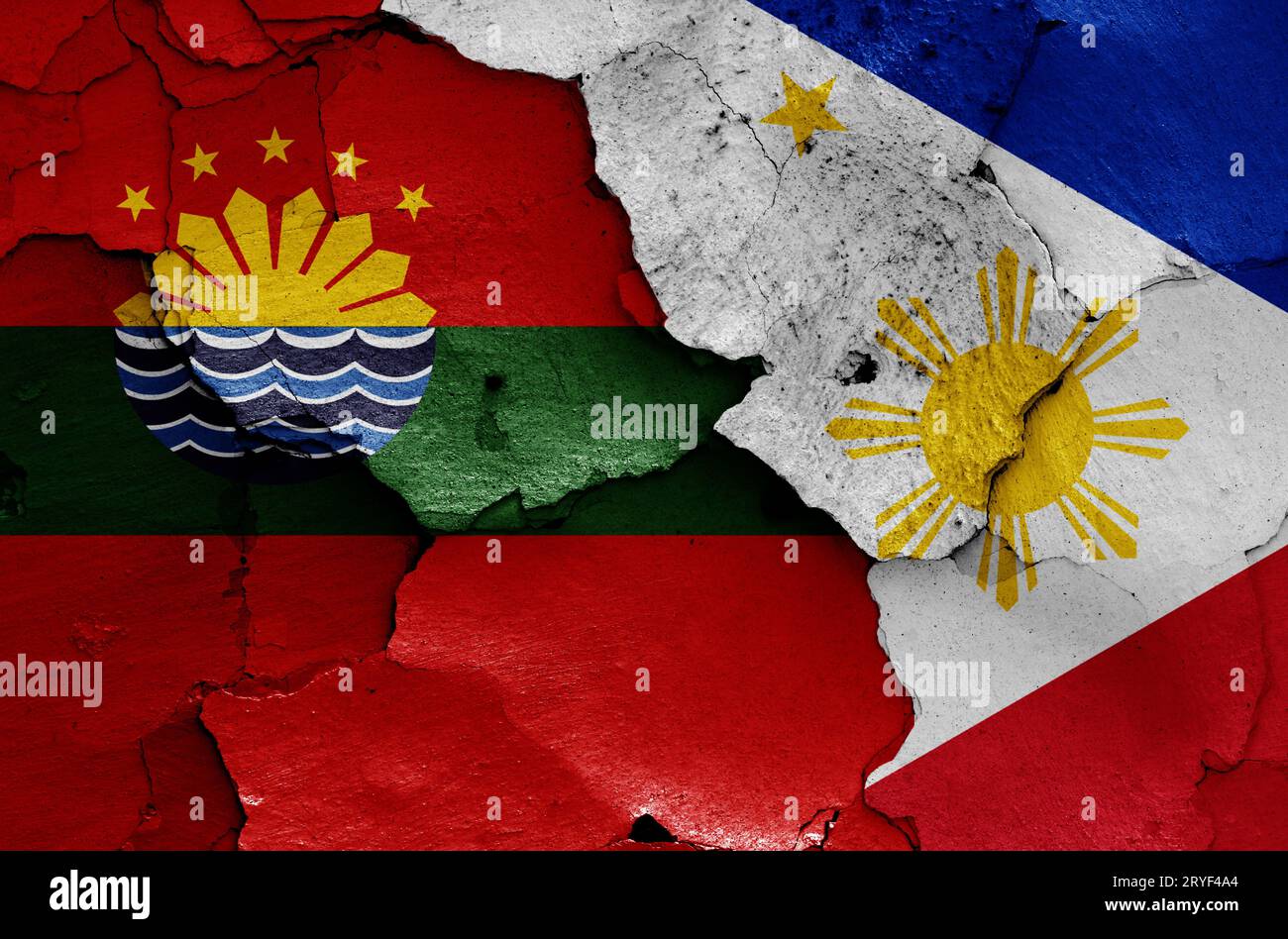 Flags of Cavite City and Philippines painted on cracked wall Stock Photo