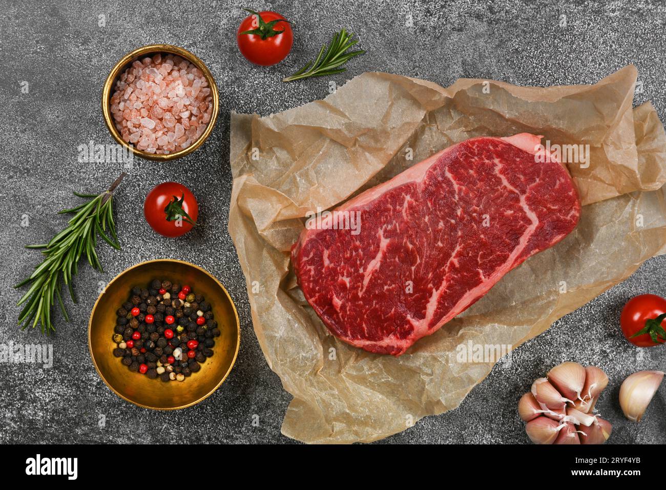Close up raw beef sirloin steak on board Stock Photo