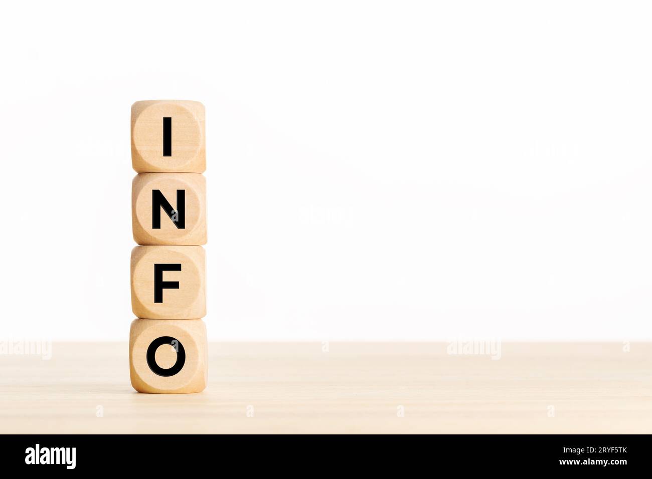 INFO text on a pile of wooden blocks on table. Copy space Stock Photo