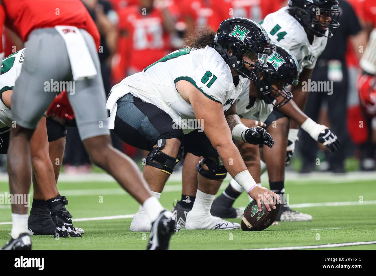 https://c8.alamy.com/comp/2RYF6T5/las-vegas-nv-usa-30th-sep-2023-hawaii-rainbow-warriors-center-eliki-tanuvasa-61-waits-to-hike-the-ball-during-the-second-half-of-the-college-football-game-featuring-the-hawaii-warriors-and-the-unlv-rebels-at-allegiant-stadium-in-las-vegas-nv-christopher-trimcsmalamy-live-news-2RYF6T5.jpg