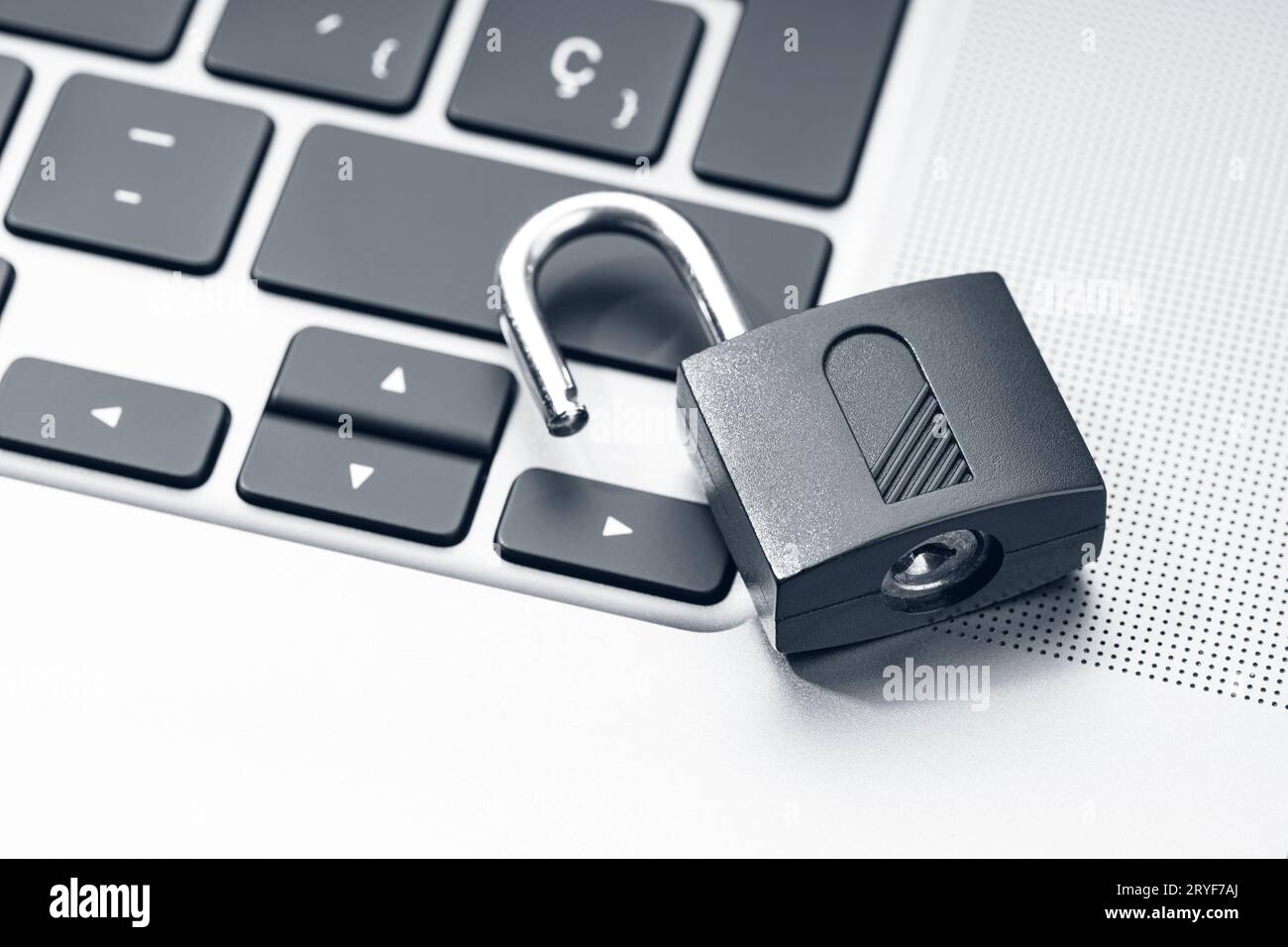 Open padlock on modern laptop. Computer Security Vulnerability concept Stock Photo