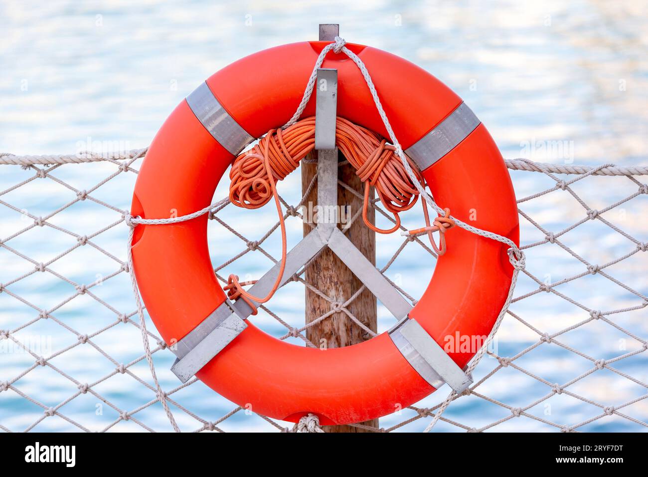 Safeguard ring at the beach. Device helping to float on water. Rescue assistance. Stock Photo