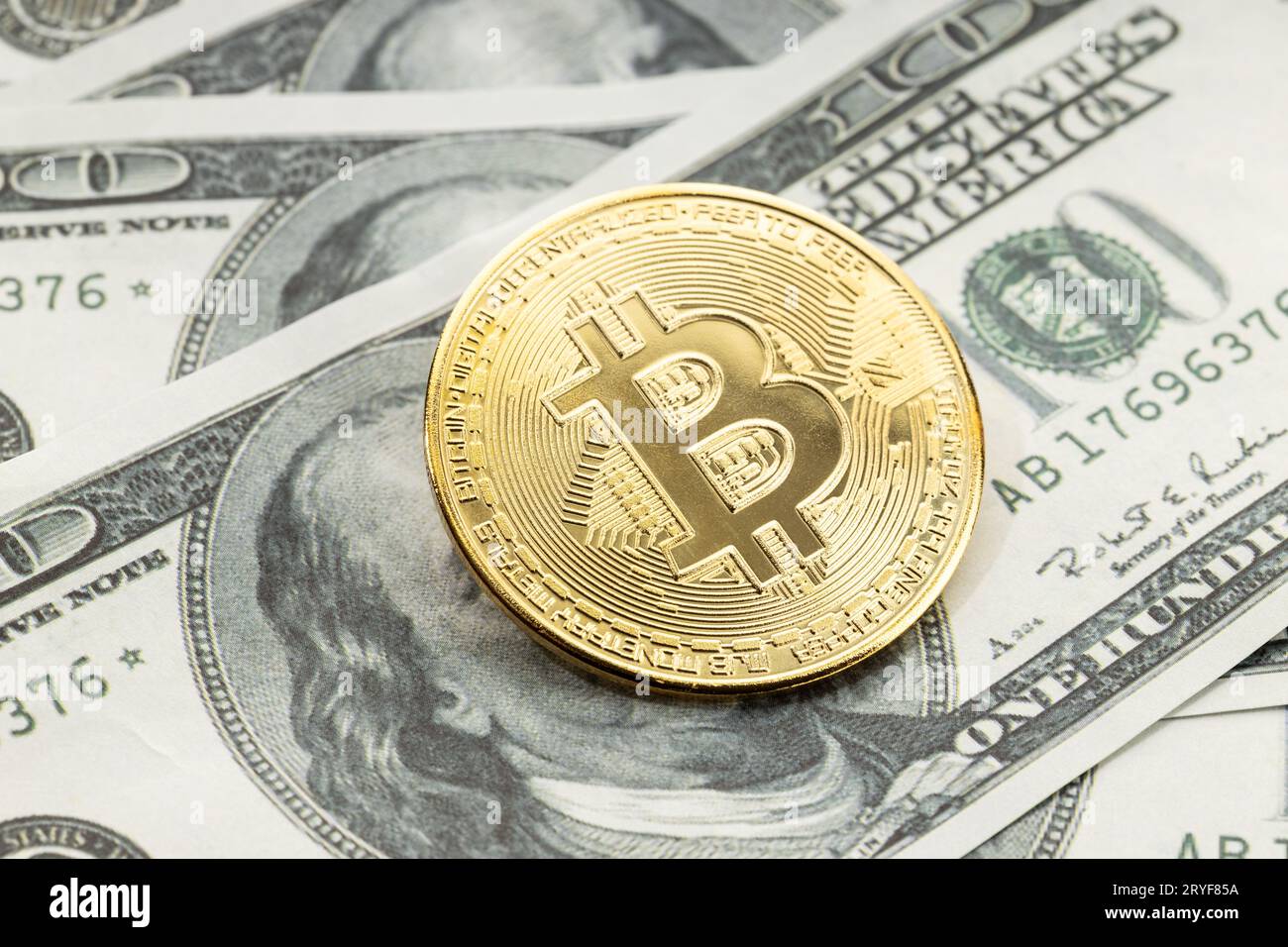 Bitcoin on dollar banknotes bills close up photo of crypto currency and  real money Stock Photo - Alamy