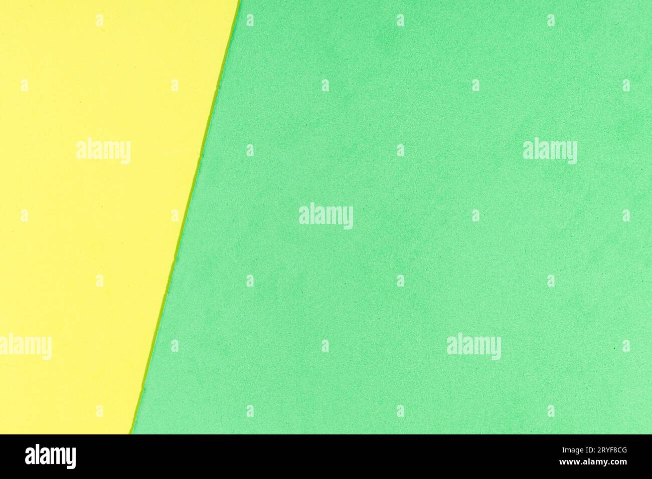 Yellow and green foam sheet with diagonal texture background. Full frame Stock Photo