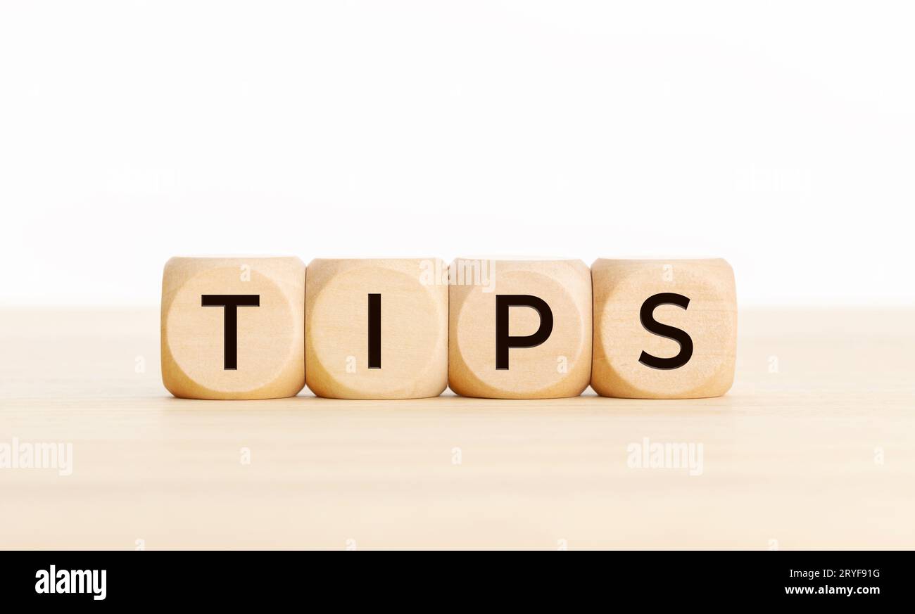 TIPS word on wooden blocks on table. Copy space Stock Photo