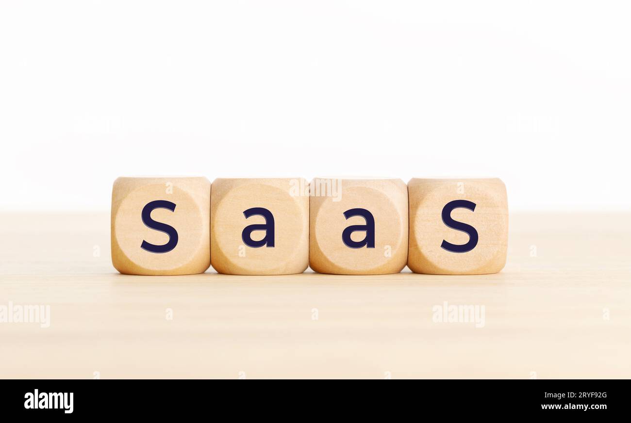 Saas word on wooden blocks on table. Copy space Stock Photo