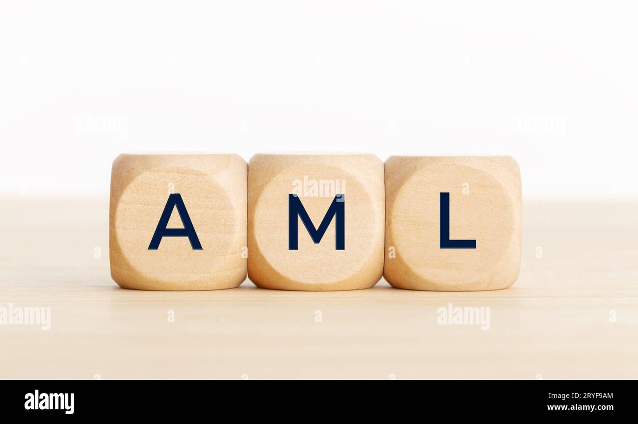 AML word on wooden blocks. Anti money laundering concept. Copy space Stock Photo