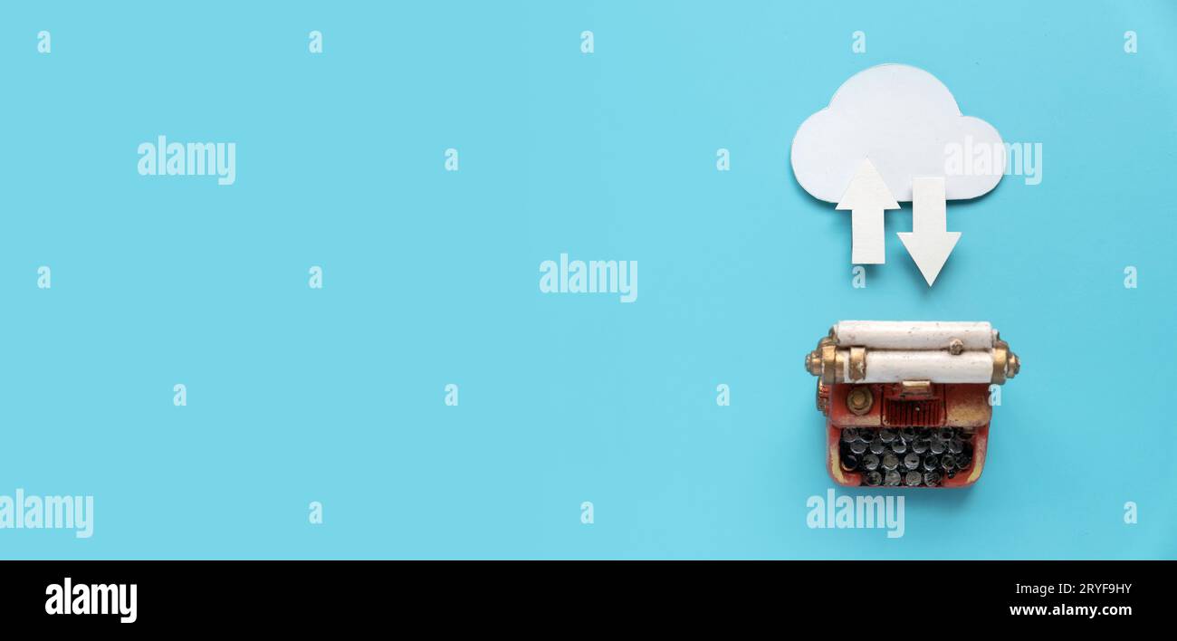 Cloud computing data storage concept.Network computing technologies. Digital server. Icon of cloud with arrow on blue background with miniature typewr Stock Photo
