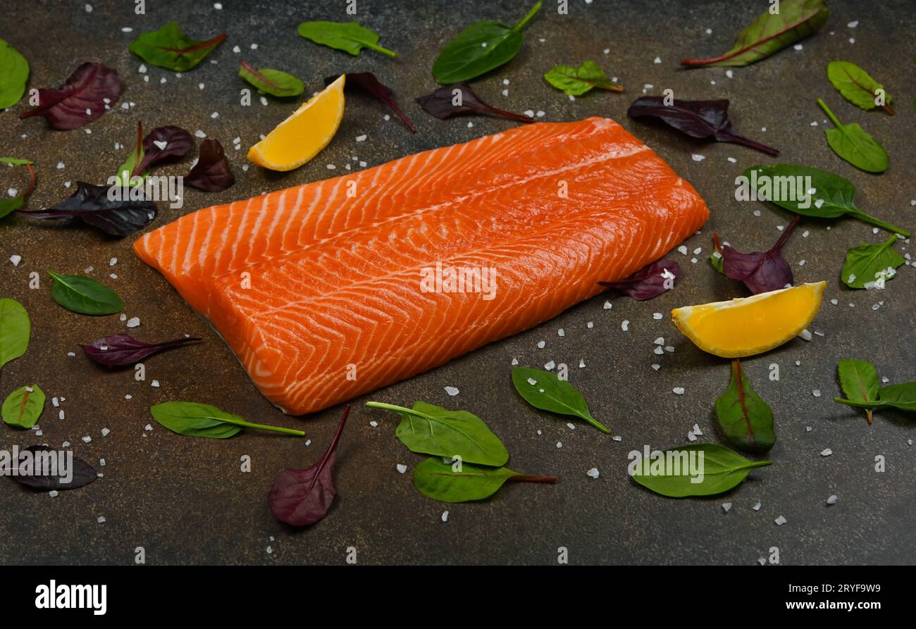 Raw salmon fish fillet on table Stock Photo