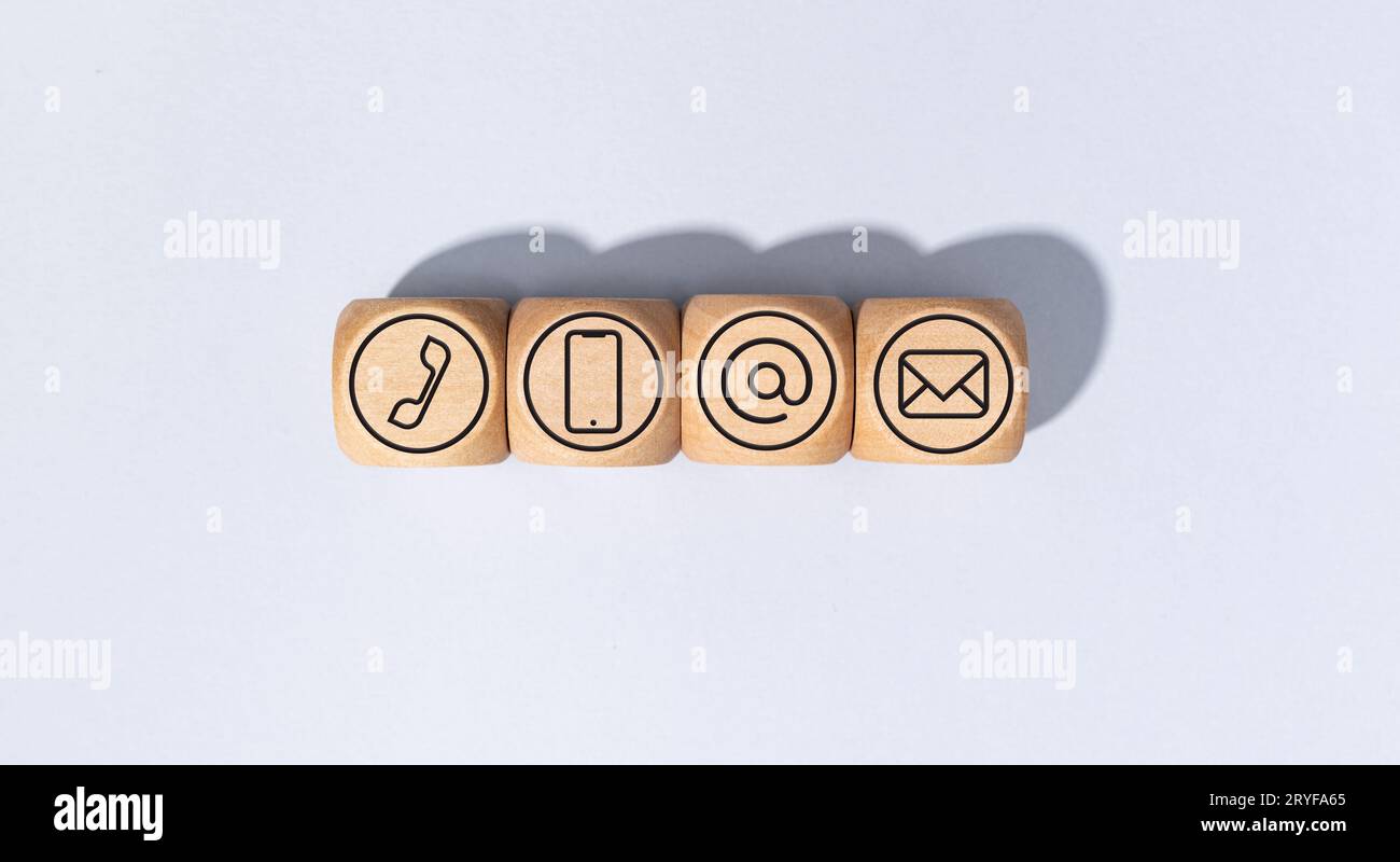 Contact us icons on wooden blocks isolated on gray background Stock Photo