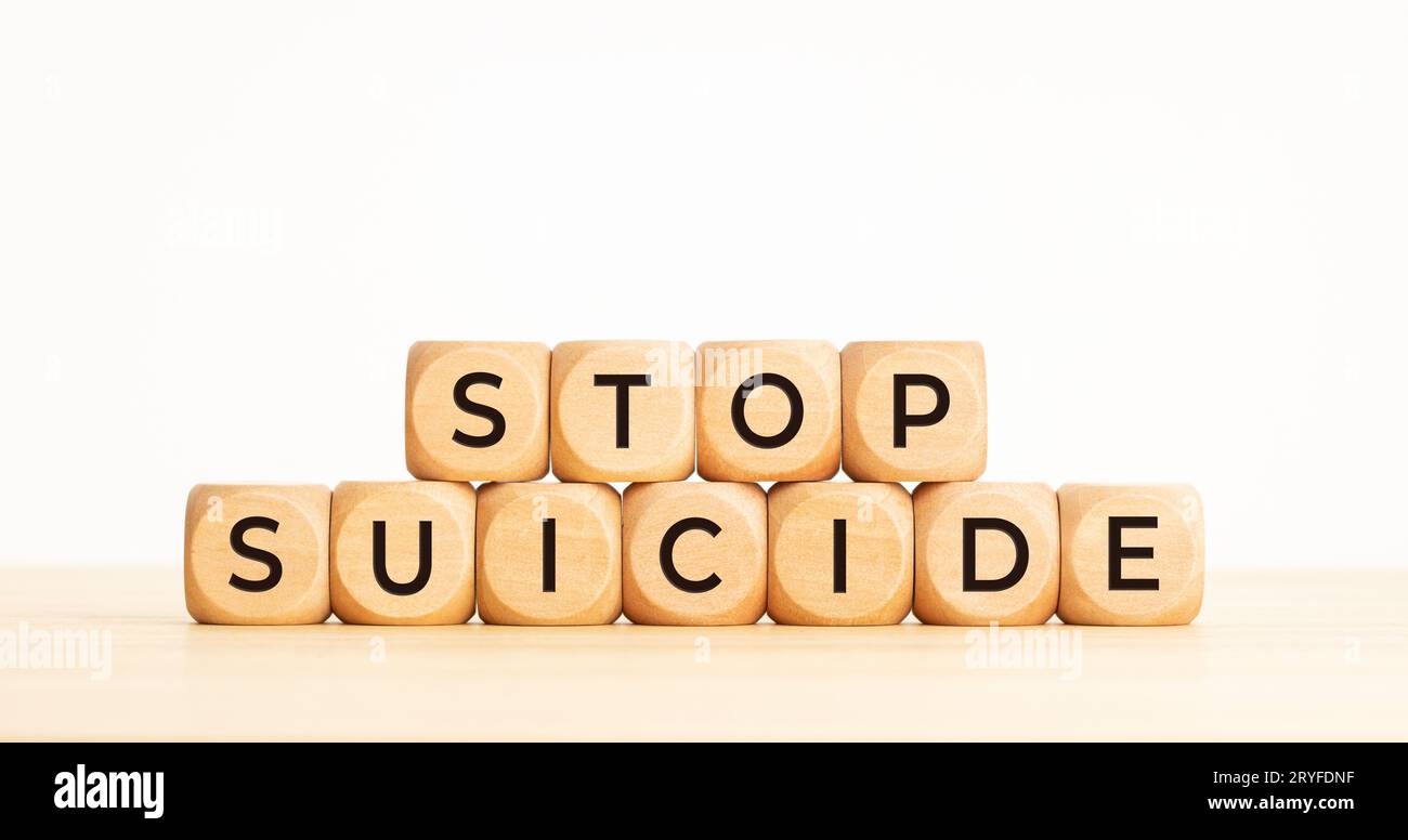 Stop suicide concept. Wooden cube block with words. Copy space Stock Photo