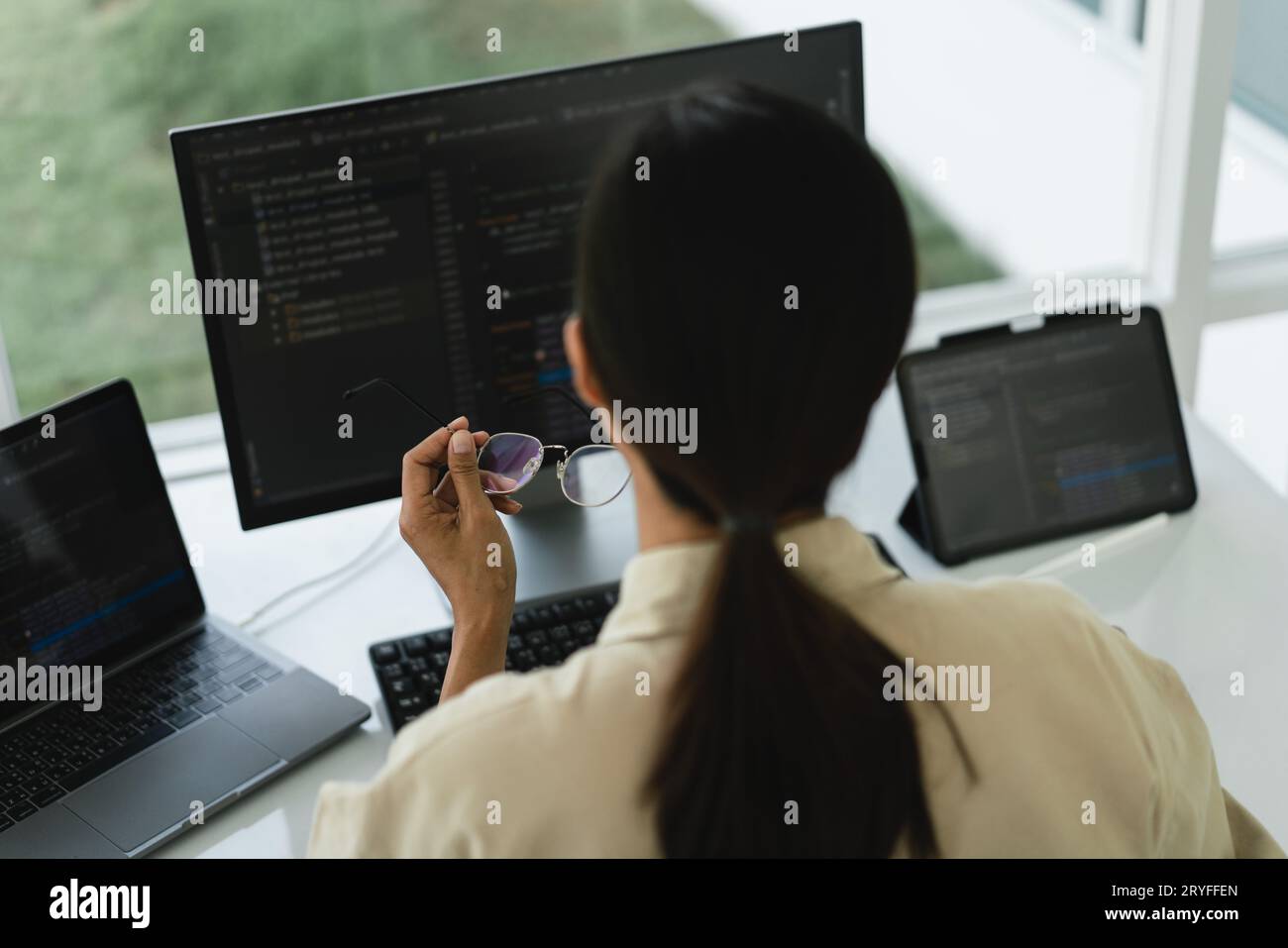 Developer programmer working to checking code on monitor while programming to developing website. Stock Photo