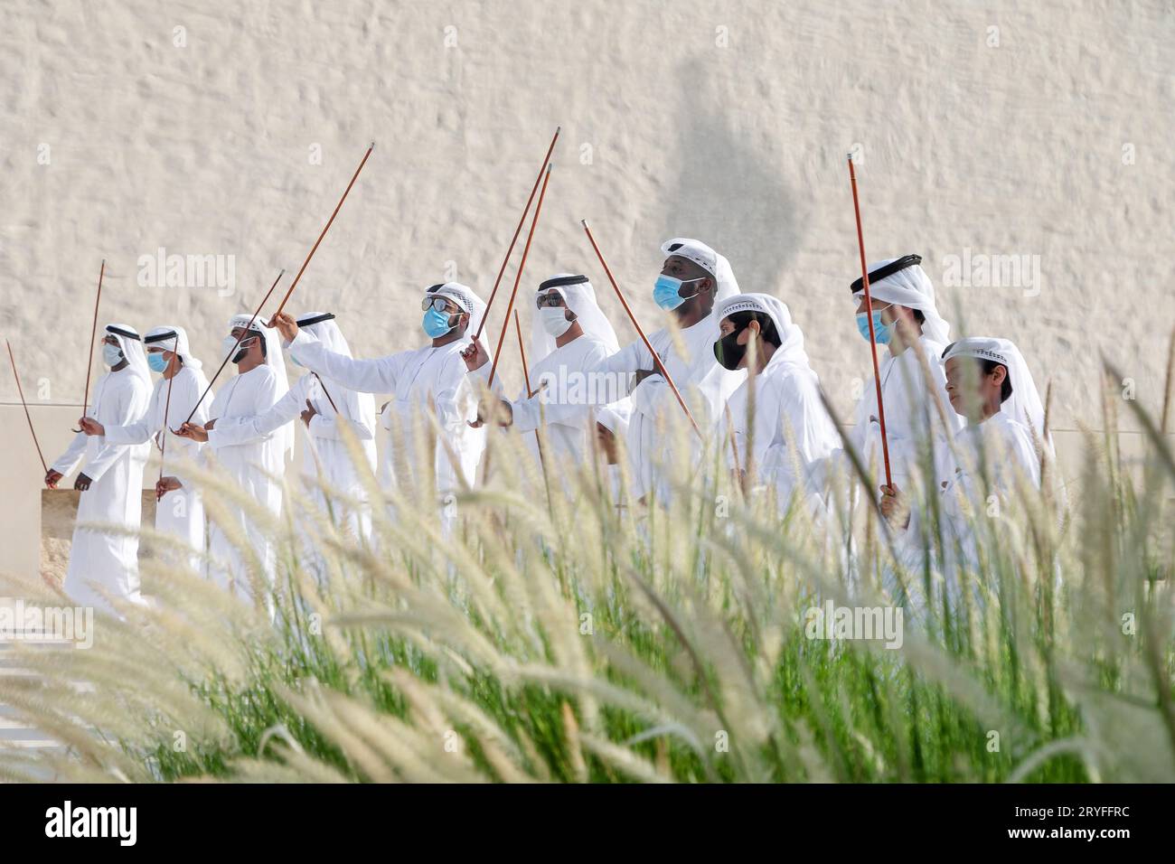 ABU DHABI, UAE - MAY 14, 2021: Traditional Emirati male Al Ayalah dance at Al Hosn Festival Stock Photo