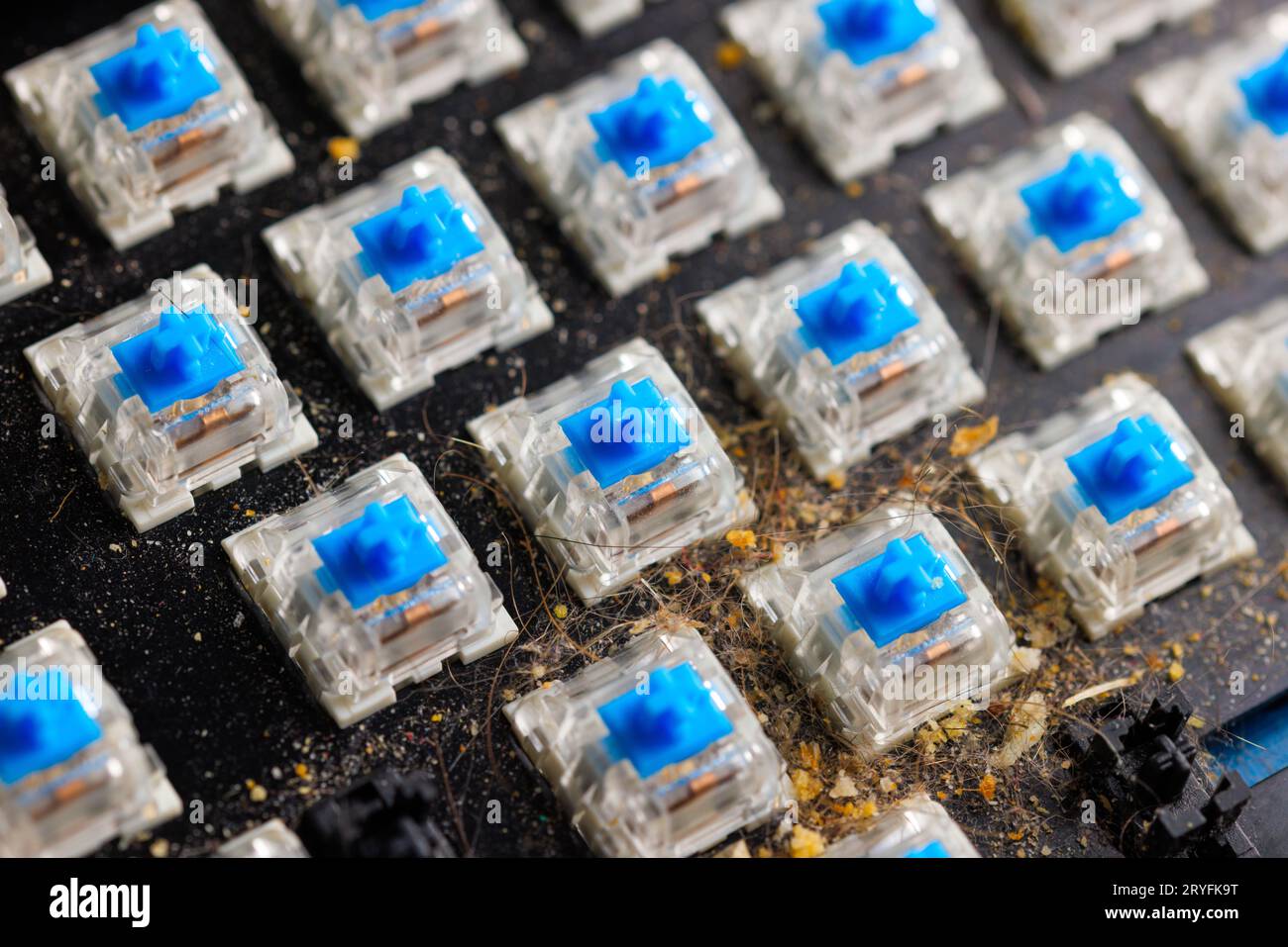 Dirty mechanical keyboard without keycaps before cleaning Stock Photo