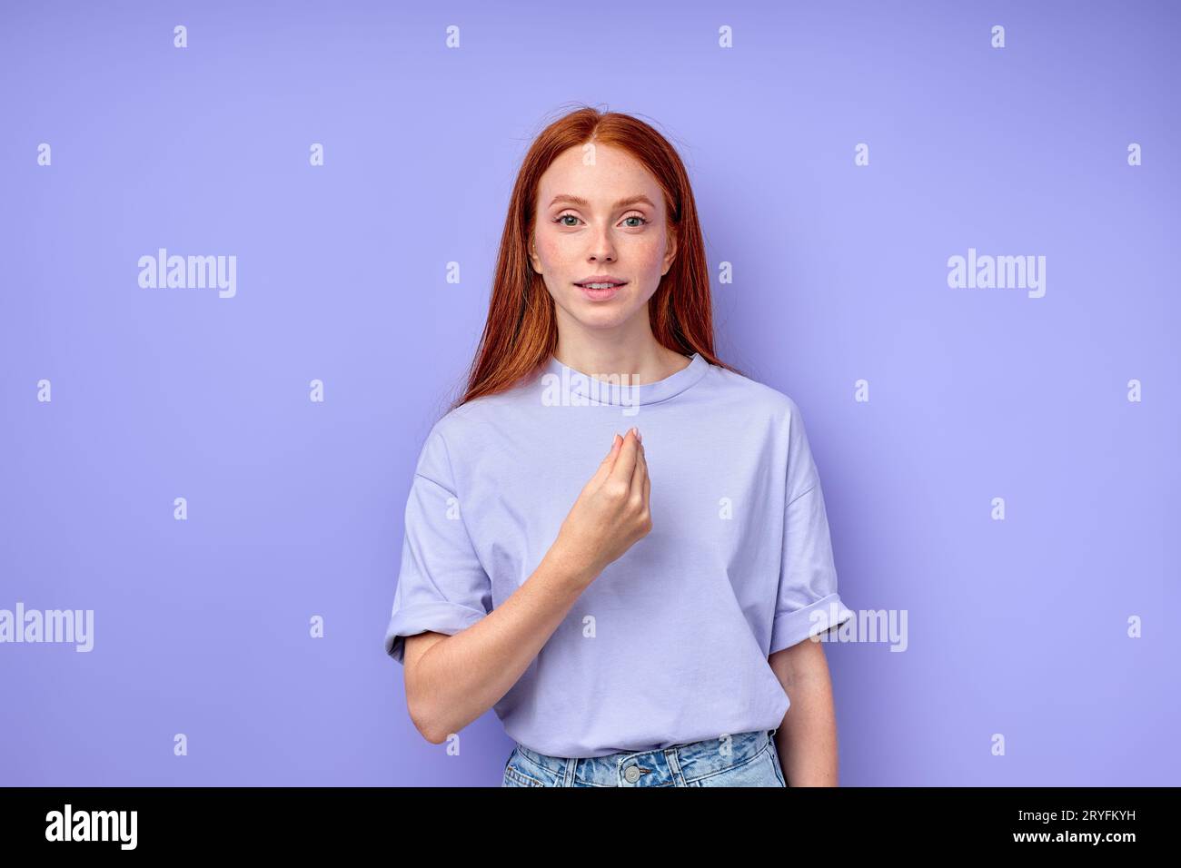 awesome red-haired girl pointing to herself me I close up portrait isolated blue background Stock Photo