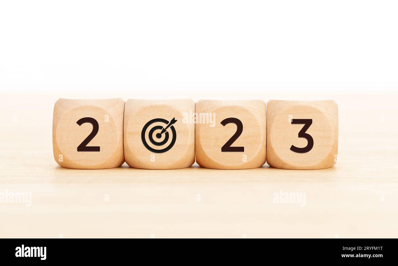 2023 goals concept. Wooden blocks with 2023 number and goal target icon