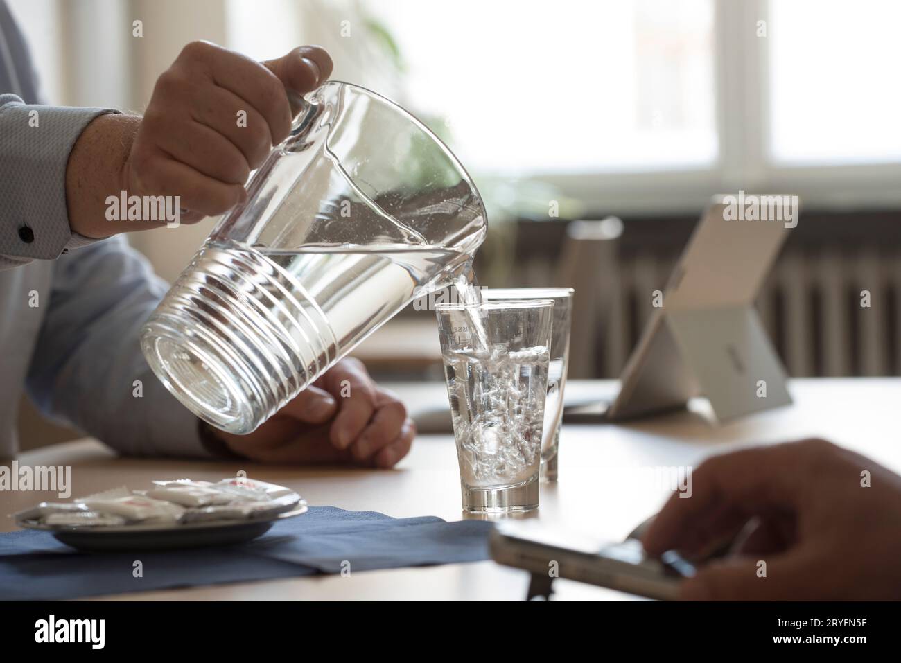 Drinking a glass of water Stock Photo - Alamy