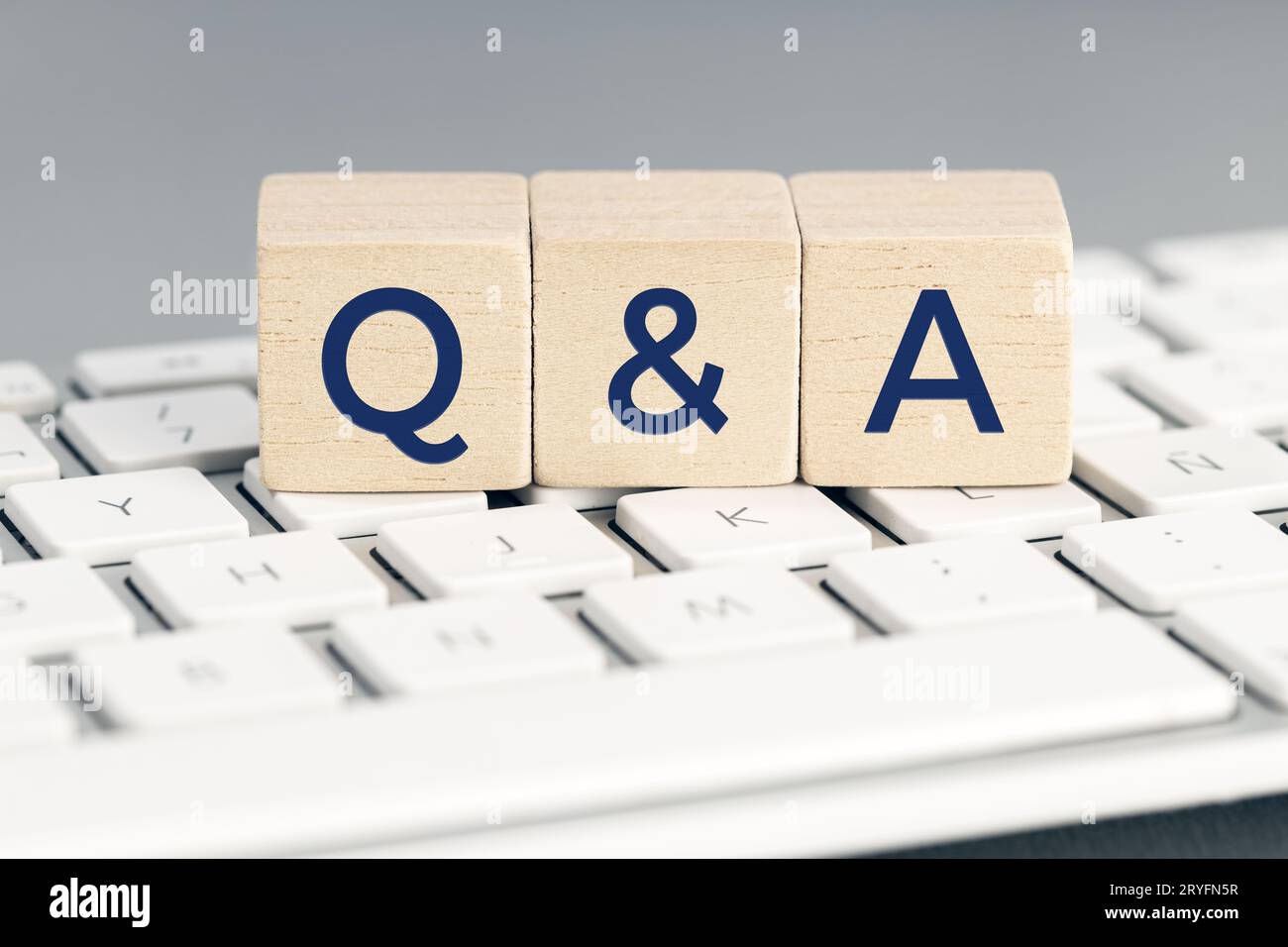 Q&A word on wooden block on computer keyboard. Questions and answers concept Stock Photo