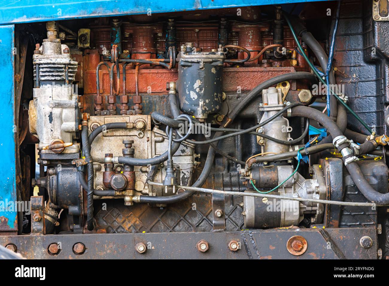 Opened diesel engine compartment of old belarussian farm tractor Stock