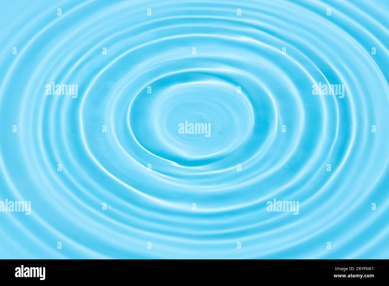 Blue Water background texture with Drop circles on water surface Stock Photo
