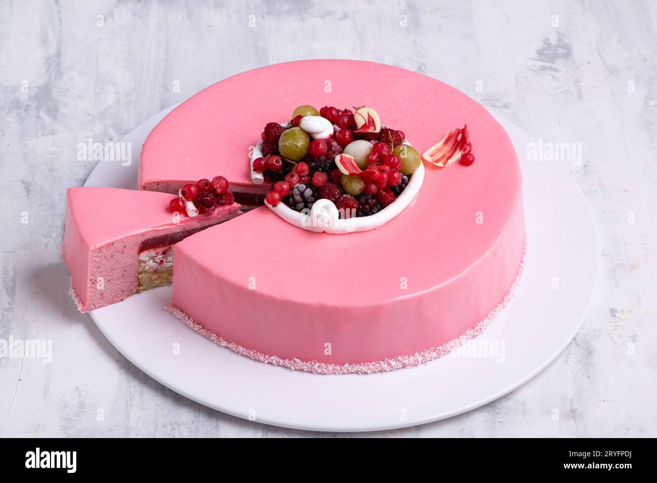 Angle shot of one piece cut from a beautiful berry mouse cake. Stock Photo