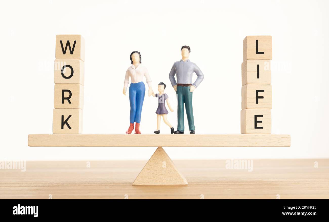 Balance Between Life And Work concept. Family figurines and Wooden ...