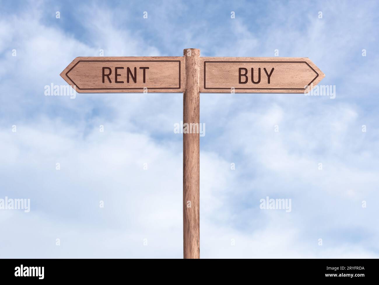 Rent or buy concept. Words in opposite directions on signpost with sky background Stock Photo