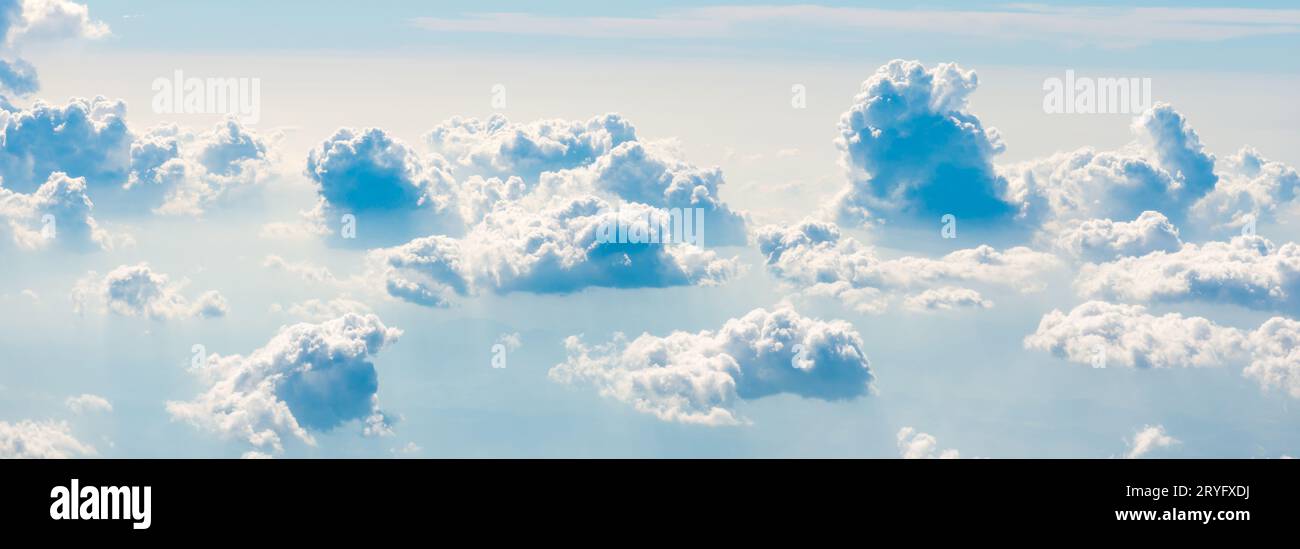 Blue sky fluffy clouds above hi-res stock photography and images - Alamy