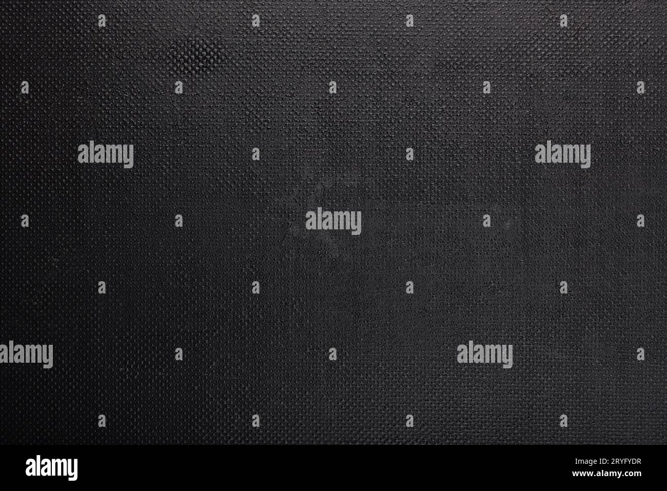 Black rough plastic surface with regular artificial pimply bumps Stock Photo