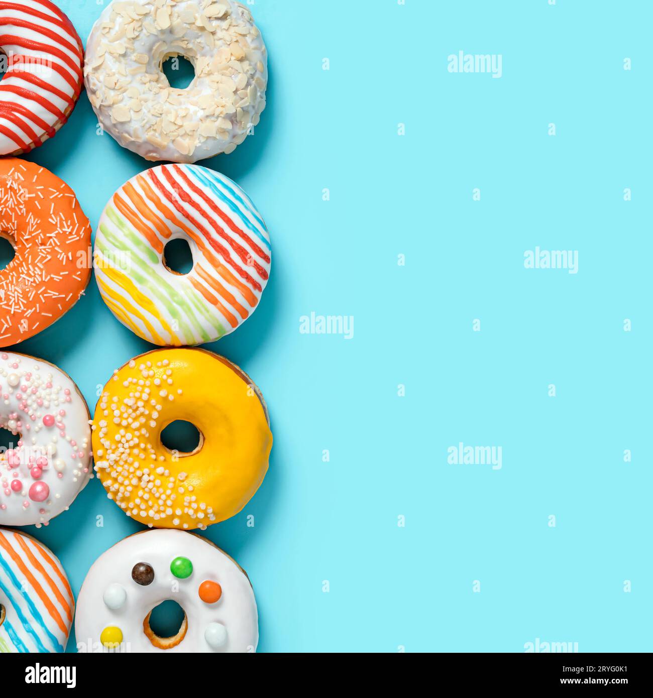 Glazed donuts on colorful background, top view Stock Photo