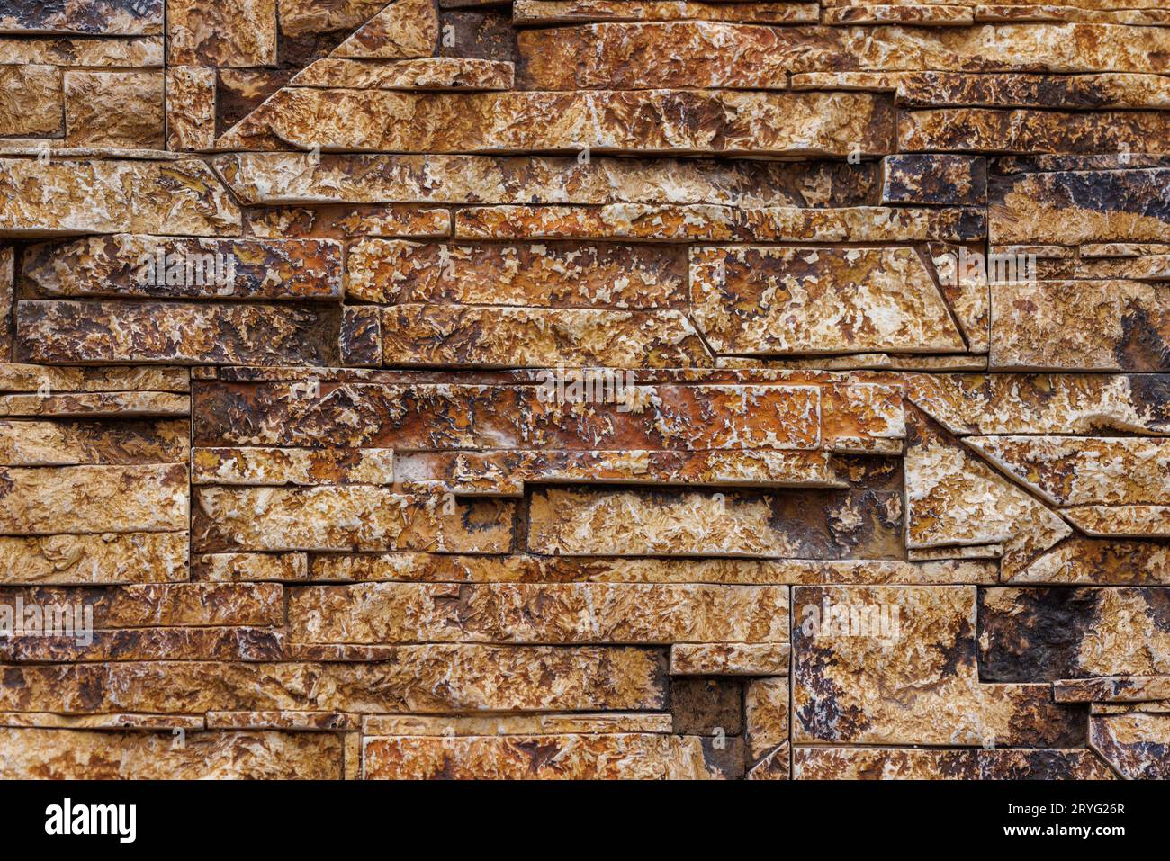 Fake stone wall, plastic panel imitating natural slab wall brickwork Stock Photo