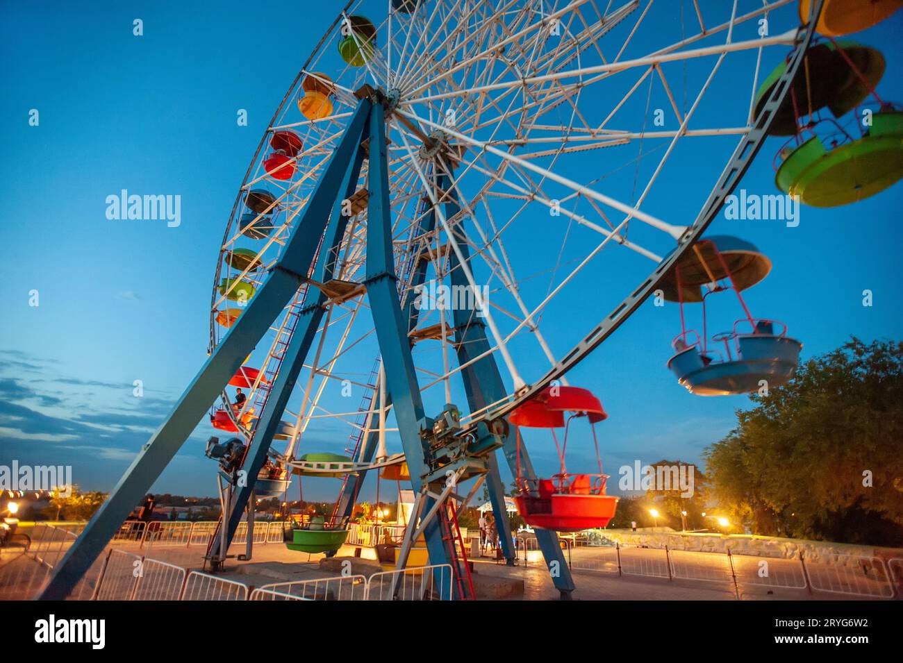 A attraction ferris wheel in the amusement park at night Stock Photo ...