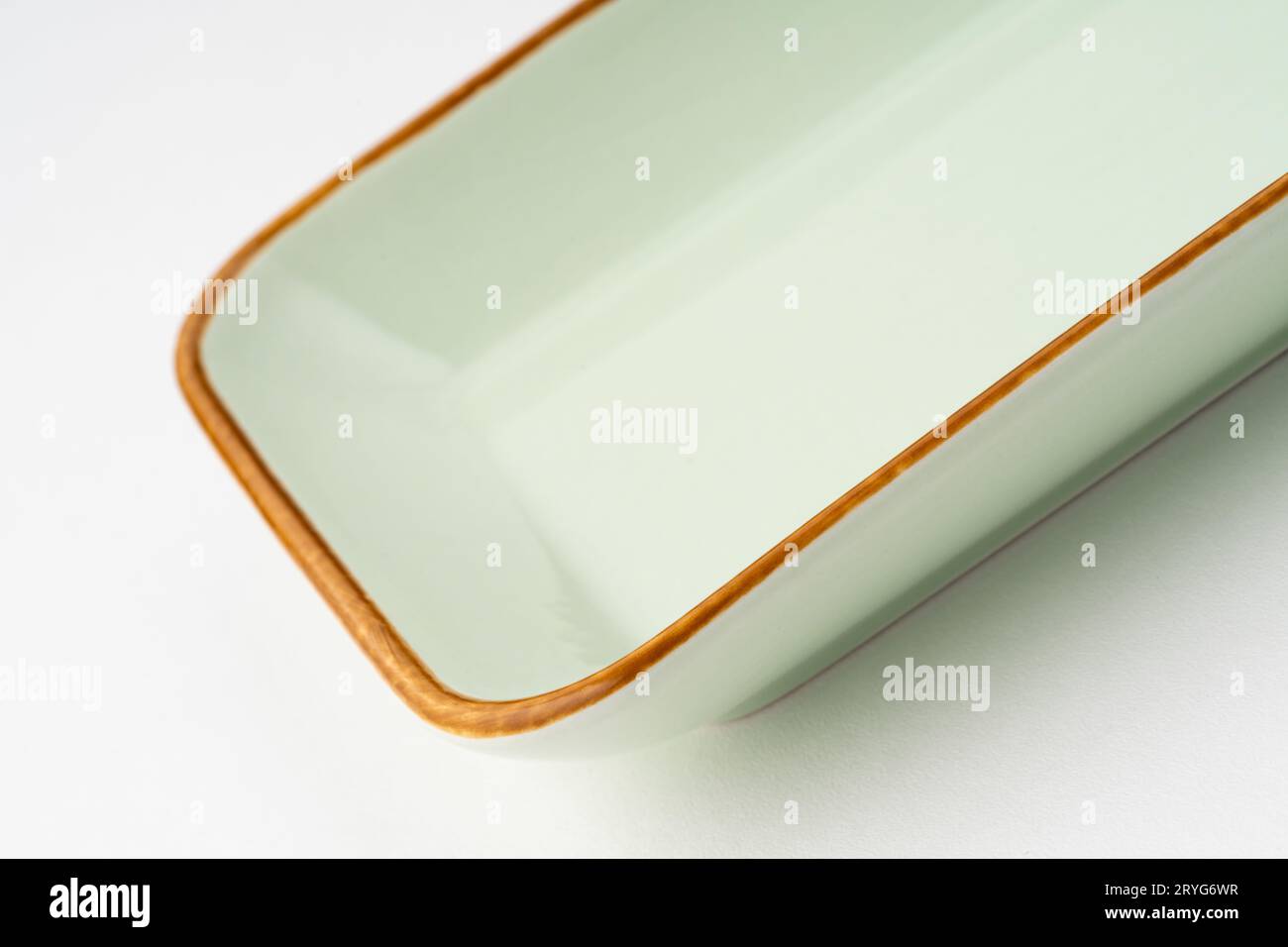 A one ceramic green rectangular plate isolated on white background Stock Photo
