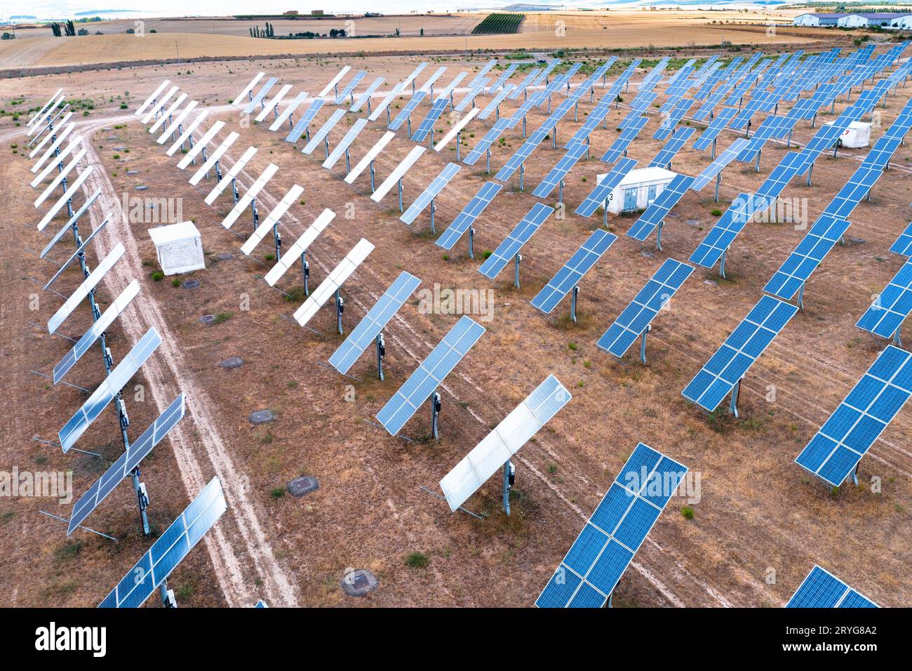 Aerial view of a solar power station and solar energy panels in a rural ...