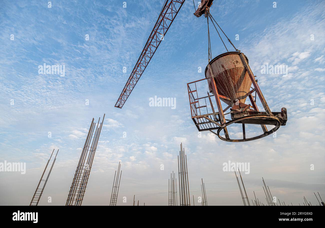 A low angle shot of a crane with equipment on a construction site near ...