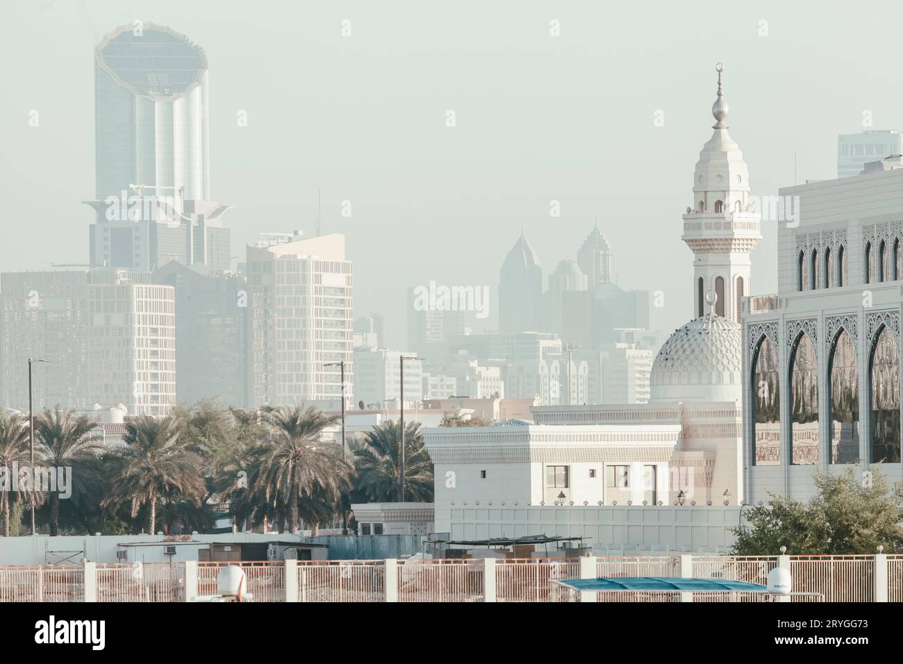 Foggy morning in Abu Dhabi, old and new buildings Stock Photo