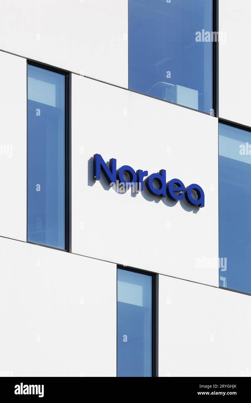 Nordea bank sign on a wall. Nordea bank is a swedish financial services group operating in Northern Europe Stock Photo